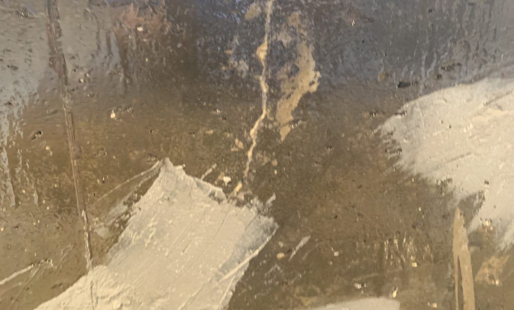 joining agent applied to crack in wall